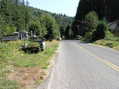#4: View South (along Myrtle Creek road).  More junked vehicles...