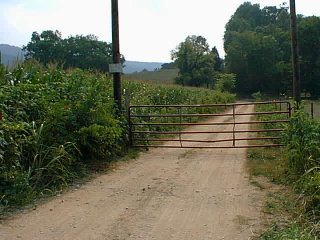 #1: The gate blocking Round Cove Road 2.5 miles from the confluence