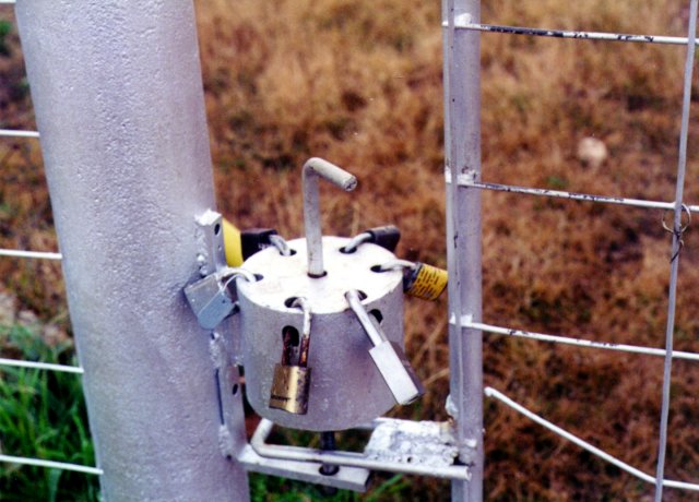 Rotary lock selector on probable access gate.
