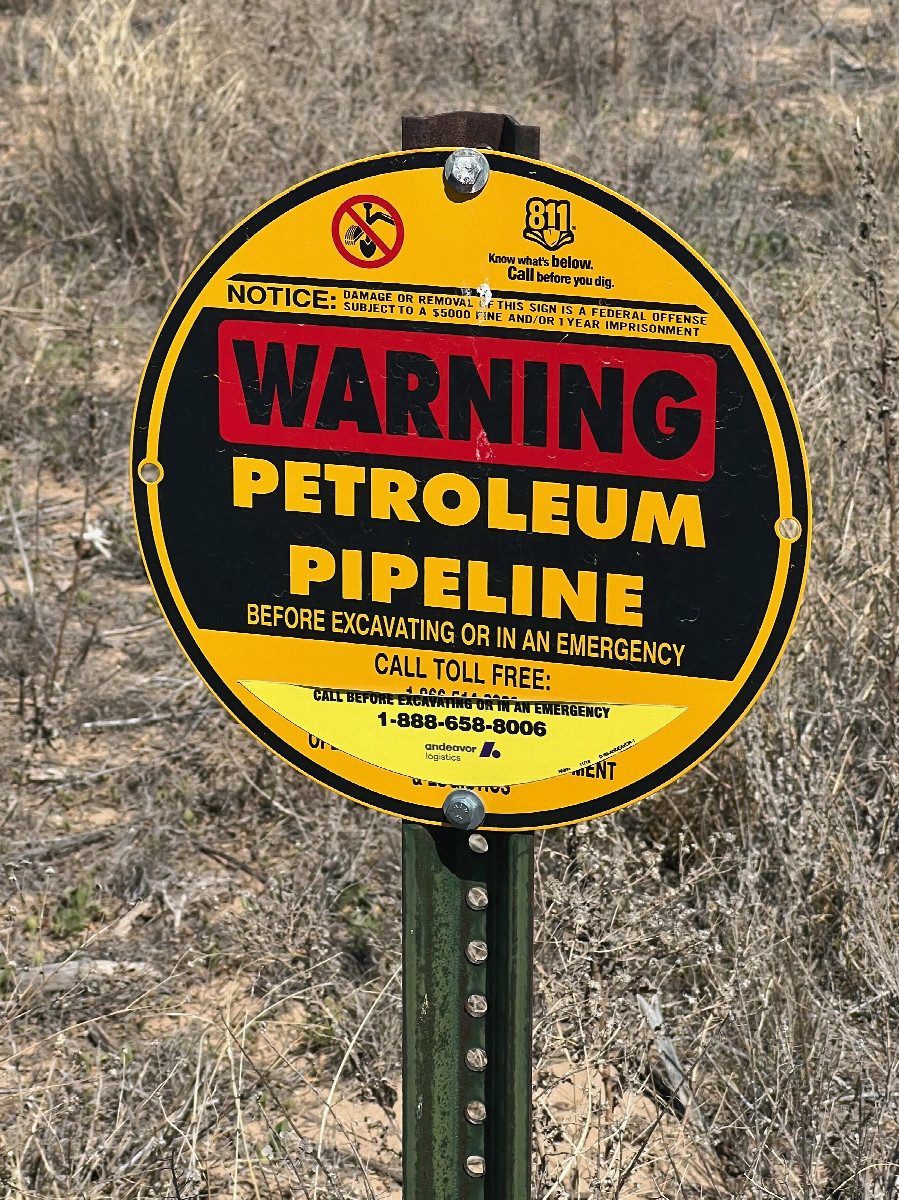 One of the many signs along the access path, warning about an underground pipeline