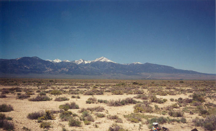 T. McGee Bear facing southeast at the point with Wheeler Peak in Nevada in the background.