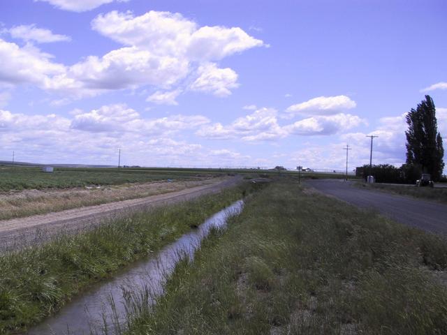 View southeast along canal and road toward Roloff Road.