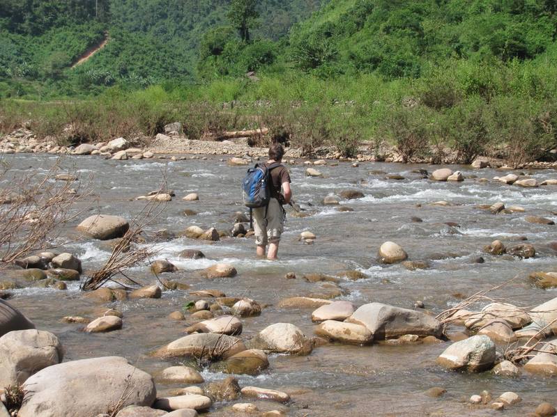 Our alternative was to climb down the canyon and ford the river several times.  Me (Greg) crossing.