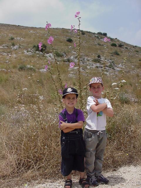 Tal & Omer next to a local flower