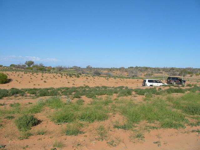Looking east, into NSW, vehicles in background