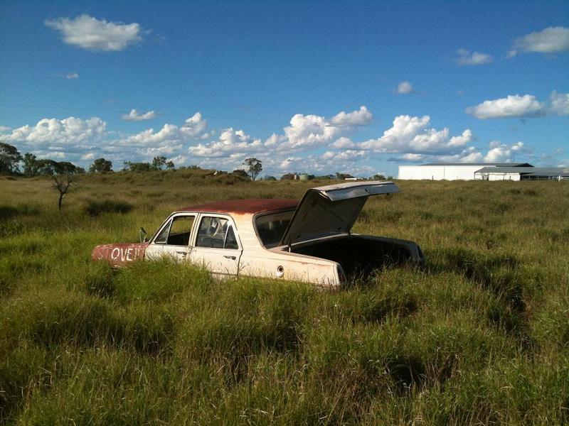 Abandoned vehicle near the confluence, with a shed in the background