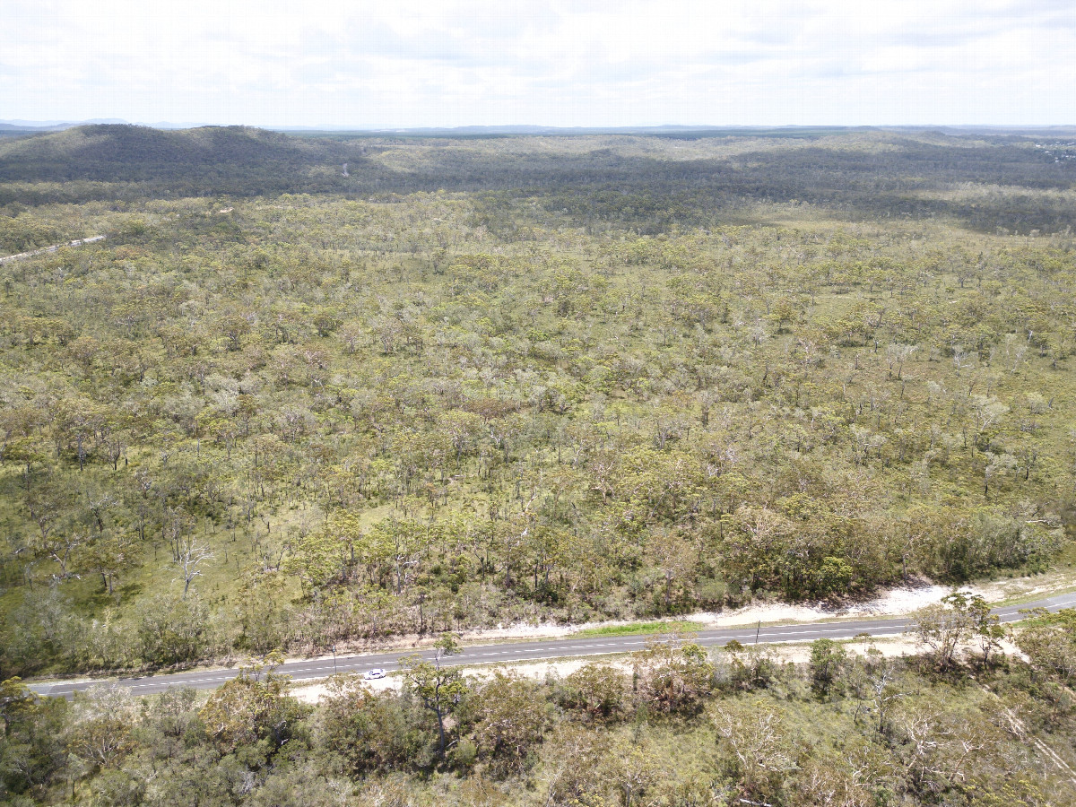 View West (towards my parked rental car beside the road 150m away), from 120m above the point