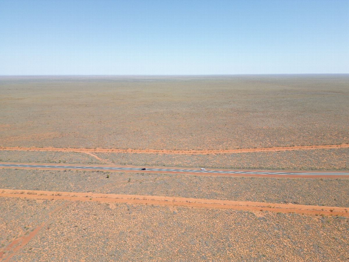 View South (across the highway), from 120m above the point