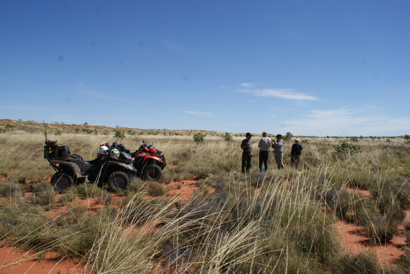 Expedition members and quads at the confluence site