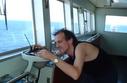 #6: Captain Peter taking a compass bearing from the point