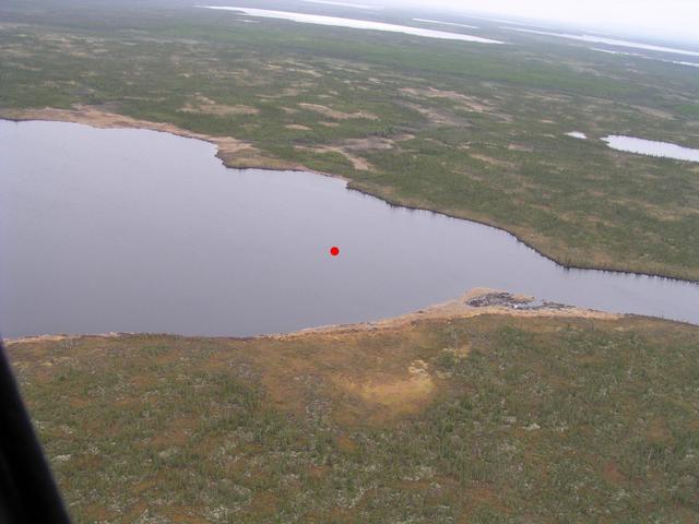 The red dot indicates the exact spot over an unnamed lake.