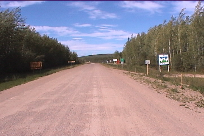 signs along road at BC/NWT border