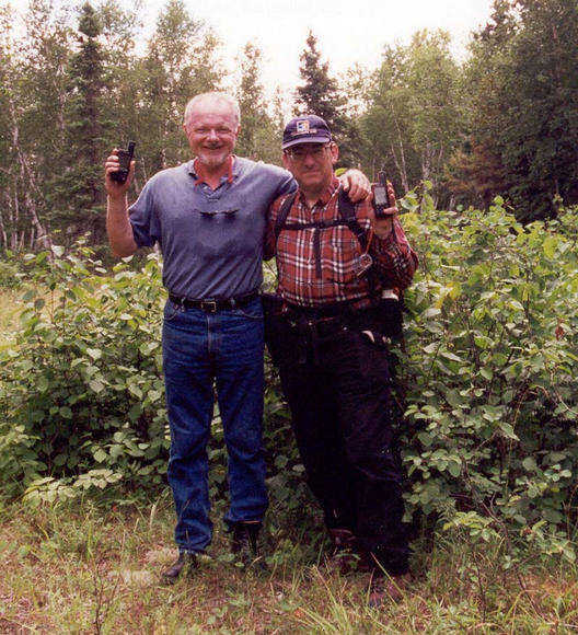 Fred and David in front of a saskatoon bush near the confluence