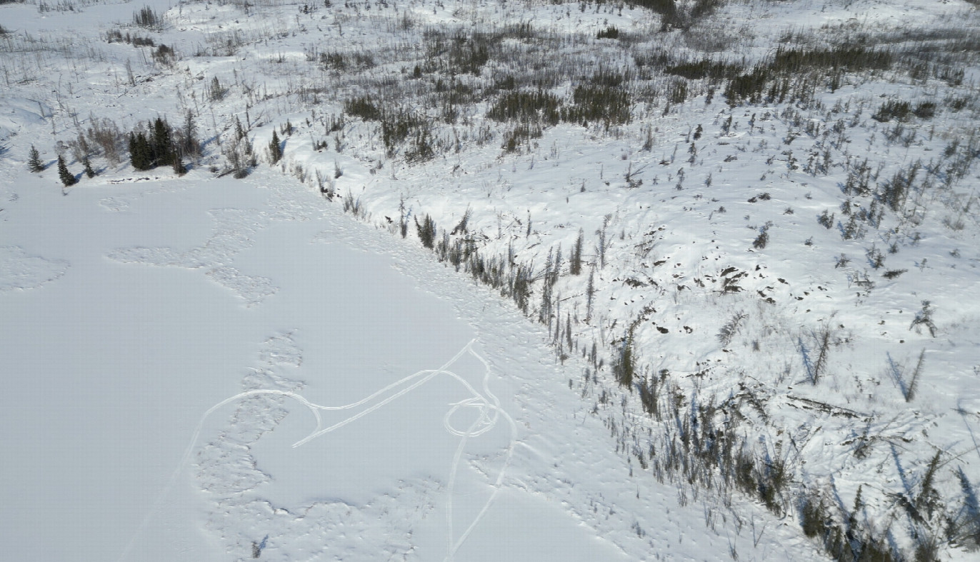 The confluence in the the circle of snowmobile tracks (taken from drone). 