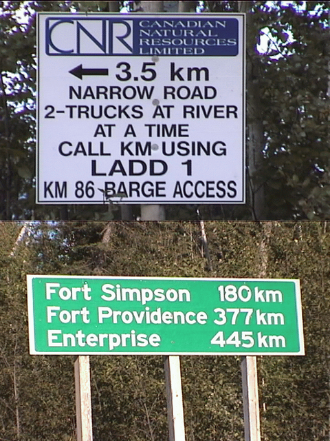 barge access sign, and signpost at kilometer 140 marker