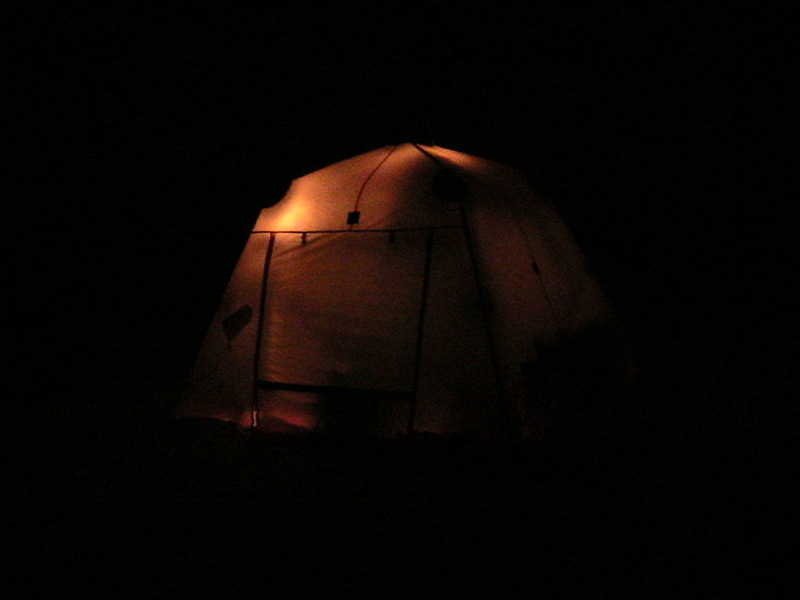 A photo of our tent, the arctic oven, taken at night while camped near the confluence. Looks like a large pumpkin.