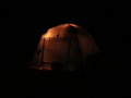 #11: A photo of our tent, the arctic oven, taken at night while camped near the confluence. Looks like a large pumpkin.