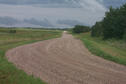 #10: The road heading north towards our next confluence.  Will those clouds bring more rain?
