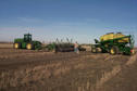 #7: An "air seeder" being used to spread fertilizer on the field.  Avonlea can be seen in the distance on the left.