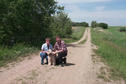 #6: The three of us posed on the road leading to 51°N.  There is a pond directly behind the trees to the left of the picture.