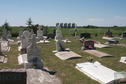#9: A small cemetery situated directly east of the confluence. The steel grain bins in the background are the same ones seen in the view looking east.