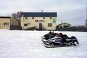 #8: Snowmobiles parked at Ronnie's Tavern and Confectionery in Macdowell.