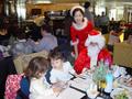 #3: Father Christmas and his pretty helper visit the children.