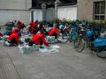 #2: Kunming Newspaper carriers assembling the newspapers before delivery