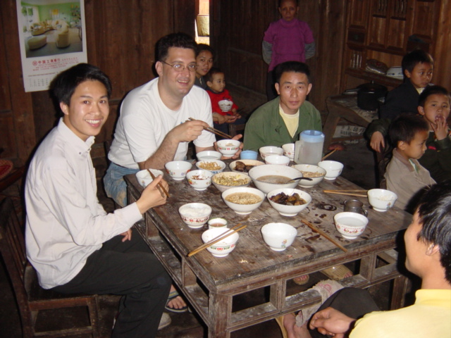 Left to right: schoolteacher, Tony, schoolteacher's "father", plus various other extended family members, preparing to tuck into lunch