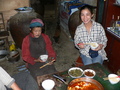 #4: Ah Feng and the landlord's mother enjoying a meal of spicy hot bean curd and pork.
