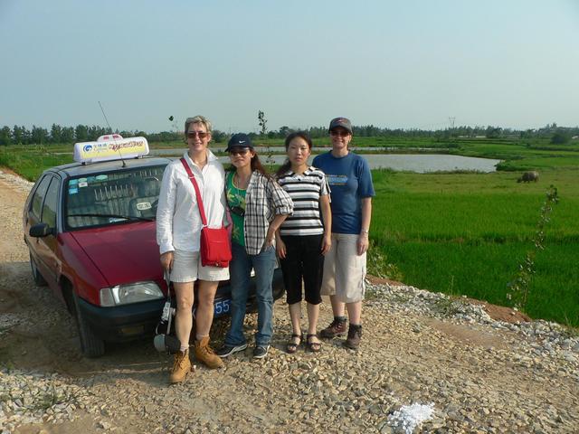 Left to right: Carmen, Ah Feng, our taxi driver and Sasha, on the dirt road 180 metres from the confluence.
