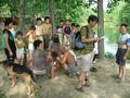 #4: Locals enjoying card game by pond; Xiao Xu records name of village.