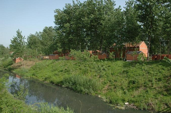 Front view of the village with polluted canal