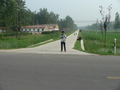 #4: Ah Feng at the start of Húzhuāng Road
