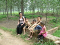 #3: Ah Feng with some children relaxing on a small bridge