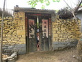 #5: Wall made from stone, with an old wooden door