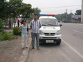 #10: Ah Feng with our police escort at the side of the main highway