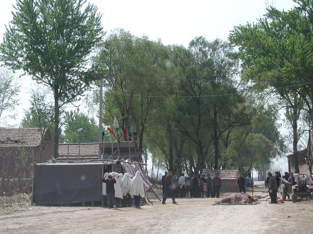 Nearest village with a funeral in progress