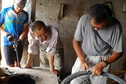 #3: 老李在田边的空房子里补胎 / Old Li repairing his bicycle tire in an empty shed by the field