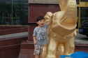#2: Andy with one of the golden elephants in front of the hotel