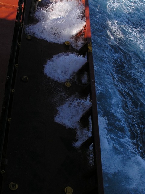 Breakers splashing on the ship's main deck