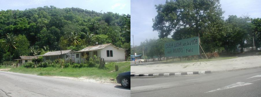 Houses a few kilometers away with rock outcroppings in the background; a typical sign along the road leaving Habana.