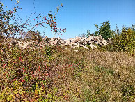 #9: barrier of railway sleepers; from field towards parking