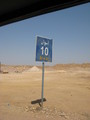 #5: Road sign showing the distance back to Aswān