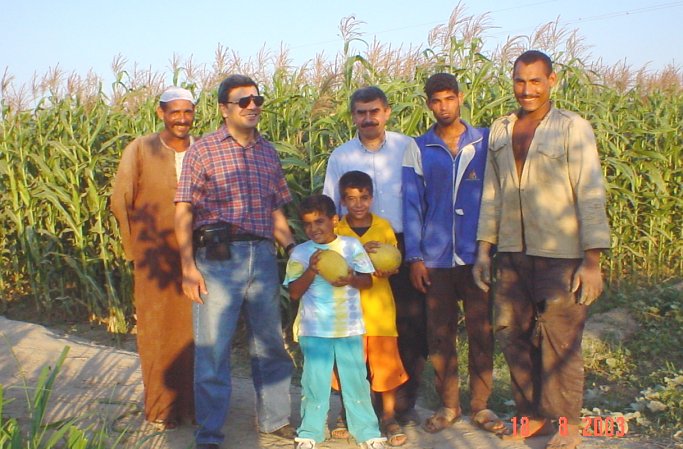 Group photo, from right to left, farmer, farmer, Ahmad, Adam, Ibrahim, Omar, and farmer. Photo by Ghada.