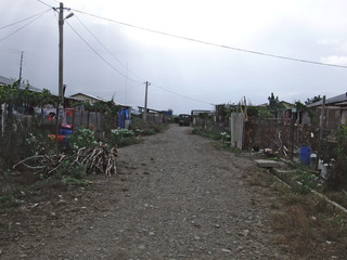 #1: View direction West towards the confluence at the right side at the end of the street