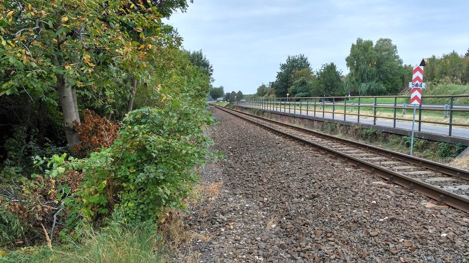 The main road and the railway track next to the CP