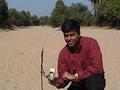 #4: Anupam at the confluence point with a smile on face and GPS in hand