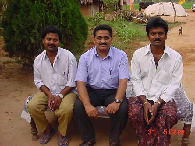 Subbaiah with seenu on his left and siva on his right near farm hut of Seenu