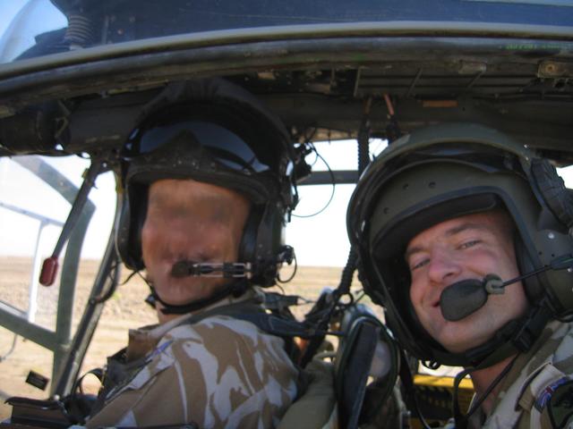 Myself with my pilot in the helicopter